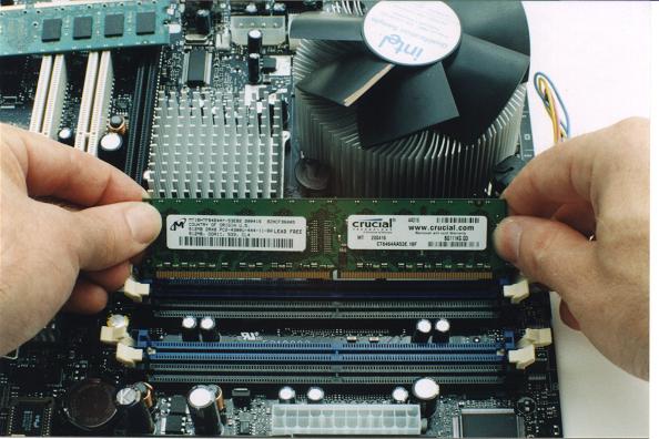 Stock image of installing RAM in a PC